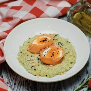 Oatmeal with pesto, soft egg and lightly salted salmon